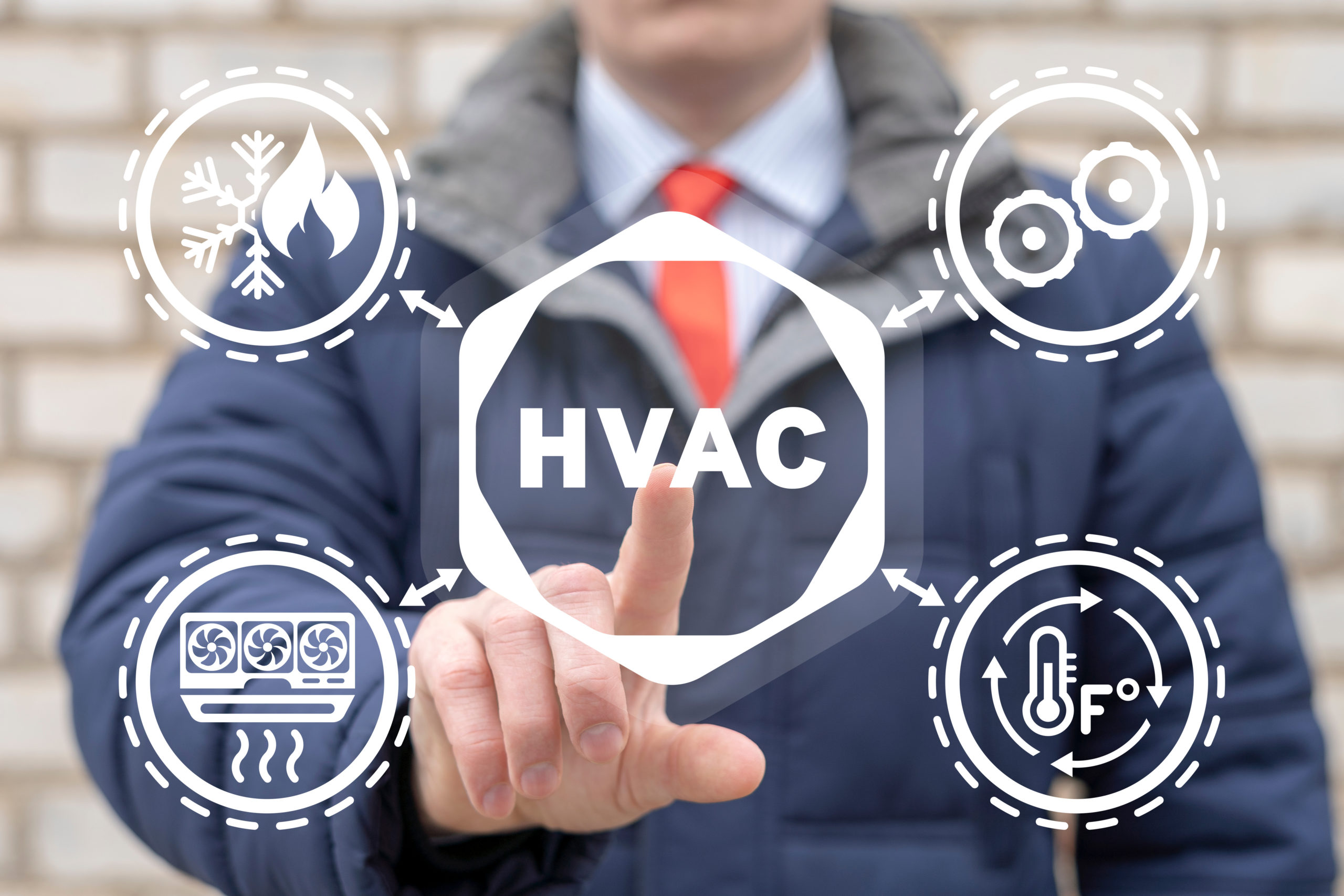 A person uses their index finger to point to the HVAC symbol. 
